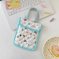 Close-up of quilted fabric mini pouch with cartoon dog patterns and dual button closure - Star Dog