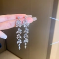 Detail of elegant silver leaf tassel earrings with sparkling crystals held by hand - 2# Silver Earring Post-Eco-Silver Leaf Zircon Tassel Style