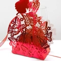Laser-cut red butterfly wedding favor box with elegant satin ribbon closure - Reflective Bright Red