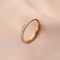 Detailed macro view of an elegant rose gold eternity ring with sparkling crystals - Size 5 / Single Row Rhinestone (2.5mm) / Rose Gold