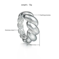 Detail of silver twisted croissant ring showing 10mm width and casting process - US 7 / Silver