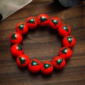 Bracelet de Noël avec perles rouges en bois et motifs d'arbres de Noël verts - Motif Arbre de Noël