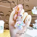 Purple cat paw oil keychain with Cinnamoroll charms, 4.5x4cm size and 21g weight - Pink Cinnamoroll Milk Bean