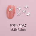Detail of 5.5mm silver butterfly nail charms with 3D texture on light pink base - Silver Textured Butterfly (AD67)