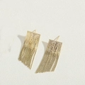 Detailed macro view of gold tassel earrings with intricate textured diamond-patterned metal - 14K Gold Rectangular Tassel