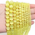 Macro shot of light yellow round cat eye stone beads for DIY jewelry making - 10mm/35pcs / Yellow