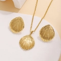 Detailed view of golden shell necklace and earrings set with fine texture on white stand - Textured Shell Shape Style (E3675)