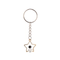 Detailed close-up of a hollow star keychain with a small astronaut figure inside - Star Spaceman