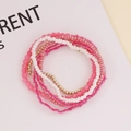 Detail of bohemian multilayer beaded bracelet set with pink white and gold beads - Pink