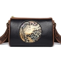 Vintage cylinder crossbody bag in black with brown trim and elephant floral embossing - Black
