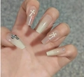 Detailed view of nude gradient coffin nails with 3D silver crosses and small rhinestones - Nude Beige Gradient 3D Silver Cross Style (BW28)