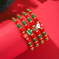 Close-up of 4-piece Christmas beaded bracelet set with Santa, tree, and snowflake charms - SY0320-1 (Cartoon Pendant 4-piece Set)