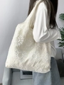 Detailed close-up of 3D daisy embroidery on a white canvas tote bag with mesh texture - Sunflower Embroidery Vest Bag