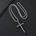 Vintage stainless steel cross pendant necklace with a twisted rope chain on stone background - Double Ring Cross Necklace (Twist Chain)