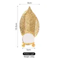 Boule de cristal décorative avec feuille de pothos dorée, hauteur 15,5 cm - Feuille de Pothos - Boule de cristal