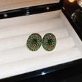 Vintage oval gold earrings with emerald green gemstones in a white velvet jewelry box - Green Rhinestone Oval Studs (Silver Pin)