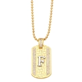 Detailed macro view of gold and silver rectangle pendant necklace with letter F and zircons - Letter F