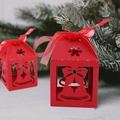 Close-up of red laser-cut Christmas gift box with bell motif and red organza ribbon - Bell Pattern / Red