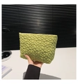 Detail of yellow-green quilted makeup bag featuring 3D floral stitching and soft fabric texture - Green
