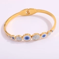 Gold titanium steel bangle with blue evil eye enamel charms and sparkling rhinestones - Big and Small Blue Eye Open Bangle