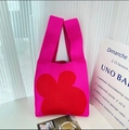 Chic rose pink knitted tote bag with bold red floral pattern and comfortable wide handles - Rose Red Four-leaf Clover