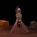 Detail of Wicca mini broom with purple crystal and Celtic bronze emblem on wood - Style 13