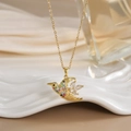 Detailed view of hummingbird pendant with colorful micro-pave zircons and gold chain - FN0127 Multi-color Pave Flying Bird