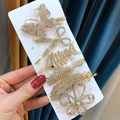 Close-up of 6 gold rhinestone hair clips including butterfly and scissors on white card - Butterfly Fishbone 6-piece Set