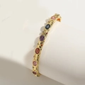 Luxurious gold-plated opening bracelet featuring colorful gemstones on a white display - Multi-Color Zirconia (SL0252-1)