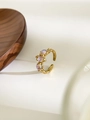 Detail of vintage irregular gold ring with three iridescent moonstone gems for women - Three Moonstones