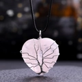 Close-up of pink quartz heart pendant with silver wire-wrapped tree of life pattern - Rose Quartz
