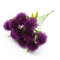 Close-up of artificial purple thistle flowers with green stems on white background - Purple