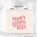 Close-up of portable square light pink leather folding mirror with don't give up text - Pink-Don't Give Up