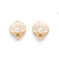 Macro detail of gold-plated seashell pendants with pink enamel and centered white pearl - Pink