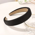 Detail view of a thick black satin sponge headband with khaki non-slip velvet inner lining - Black
