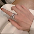 Silver snake-shaped open ring with sparkling white pavé crystals on a woman's finger - Full Zirconia Snake Ring