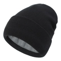 Detail of black knitted beanie showing the thick grey faux fleece warm lining inside - Black