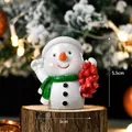 Miniature snowman figurine with red hat and green scarf on rustic wooden base - Snowman SD06
