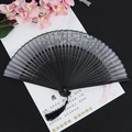 Classic black folding fan with white plum blossom pattern and long decorative tassel - Silver Flower Black Surface Black Handle