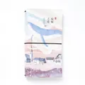 Artistic traveler journal with blue whale illustration and black elastic band closure - Soaring Whale