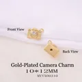 Golden camera pendant with cubic zirconia inlay, showing front and back views, 10*12mm - Gold