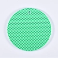 Mint green honeycomb silicone trivet mat with hanging hole for heat protection - Nordic Green
