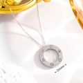 Macro detail of silver circle necklace with 6 diamonds and 26mm diameter measurement - Six-Drill Steel Color