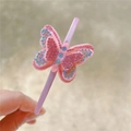 Close-up of pink headband with colorful rhinestone butterfly detail held in hand - Rhinestone Butterfly Headband (Single)