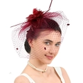 Elegant wine red bridal fascinator hat with feathers, flowers and polka dot mesh veil - Burgundy