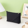 Portable dumpling-shaped cosmetic bag in black with textured and smooth fabric panels - Pleated Texture Style / Black Yuanbao Bag