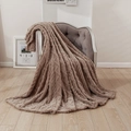 Luxurious dark coffee 3D jacquard plush blanket with diamond pattern on a grey armchair - Coffee