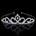 Elegant silver tiara with sparkling crystal rhinestones on a reflective black surface - Style FG016