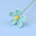 Detailed view of a hand-knitted light blue violet flower with yellow stamen and green stem - Cute Four Violet Flower Branches - Blue