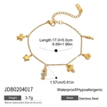Dettaglio del bracciale in acciaio inossidabile 18K con ciondoli marini e piccoli cristalli - Braccialetto con Pendenti Multipli Elementi Marini (JDB0204017)